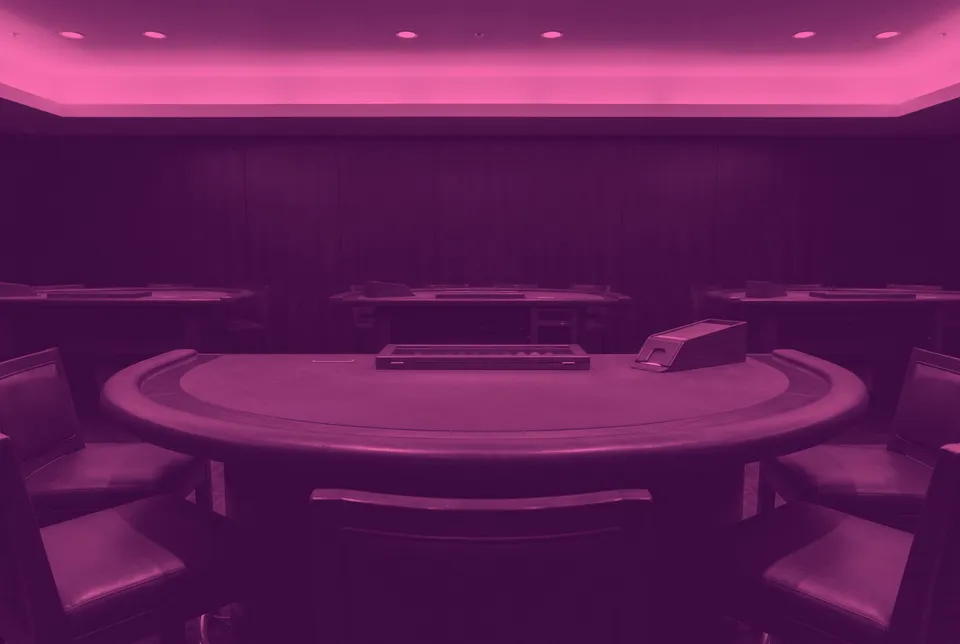 An empty blackjack table with a plain felt top and padded stools in a quiet card area, shown in two colours.